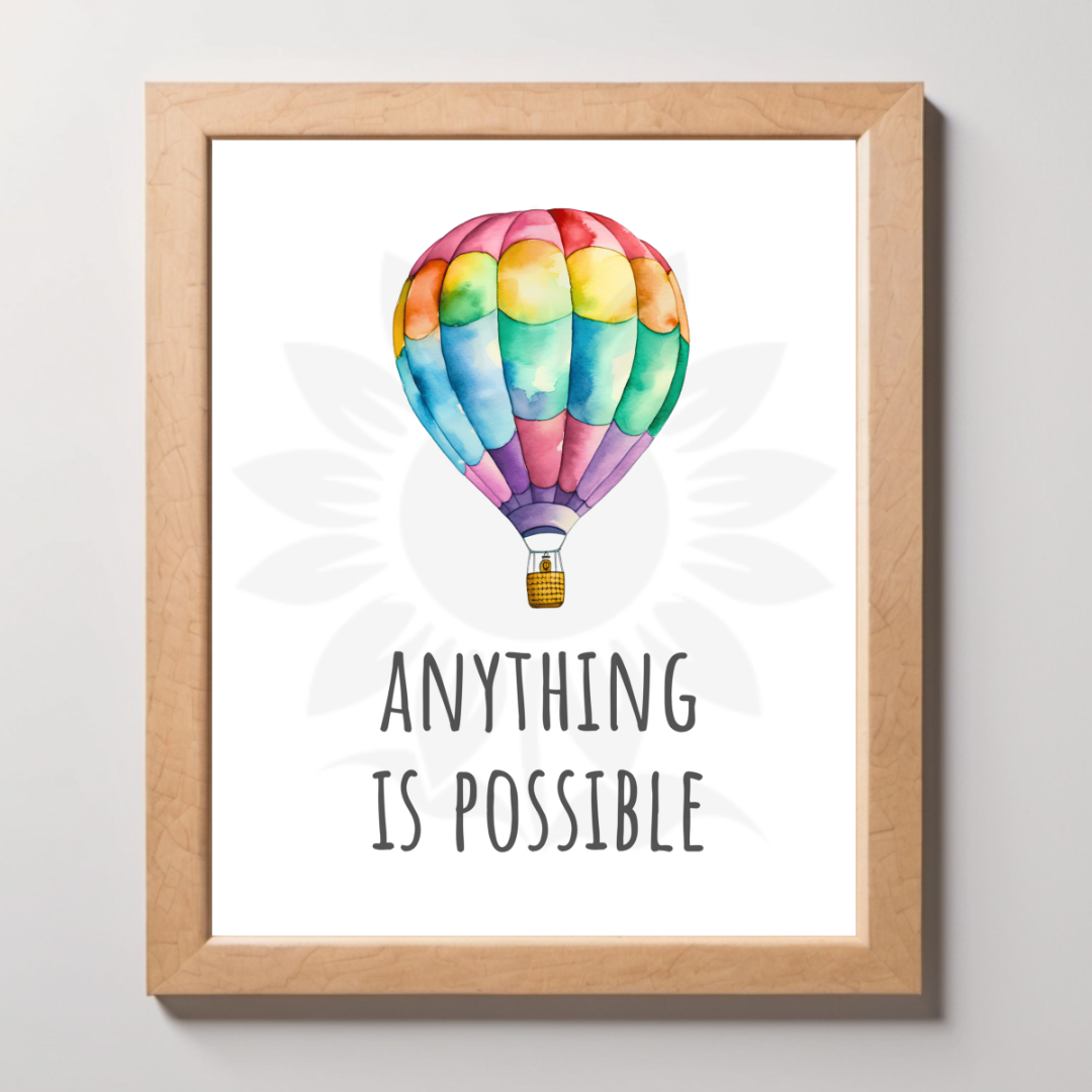 Mockup framed wall art featuring a vibrant hot air balloon with the text 'ANYTHING IS POSSIBLE.' The design is from Blossoming Minds, promoting limitless potential and positivity for children.