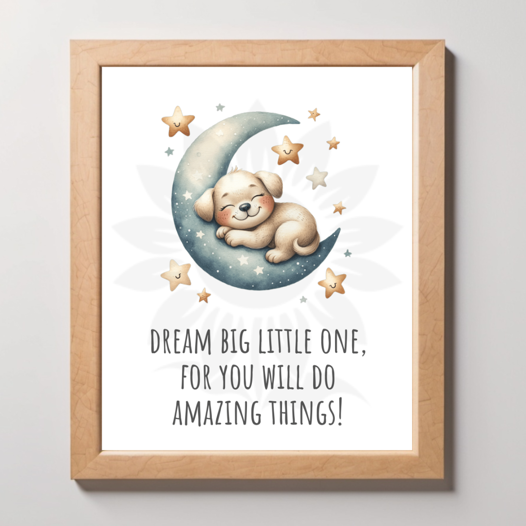 Mockup framed wall art featuring a cute puppy sleeping on a crescent moon with the text 'DREAM BIG LITTLE ONE, FOR YOU WILL DO AMAZING THINGS!' The design is from Blossoming Minds, promoting limitless potential and positivity for children