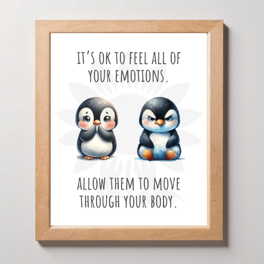 Framed wall art featuring two adorable penguins, one happy and one angry, with the text 'IT'S OK TO FEEL ALL OF YOUR EMOTIONS. ALLOW THEM TO MOVE THROUGH YOUR BODY.' The design is from Blossoming Minds, promoting emotional acceptance and well-being for children.