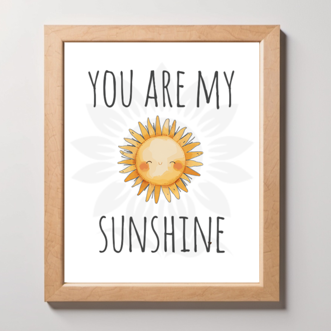 Mockup framed wall art featuring a cheerful, smiling sun with the text 'YOU ARE MY SUNSHINE.' The design is from Blossoming Minds, promoting positivity and warmth for children.